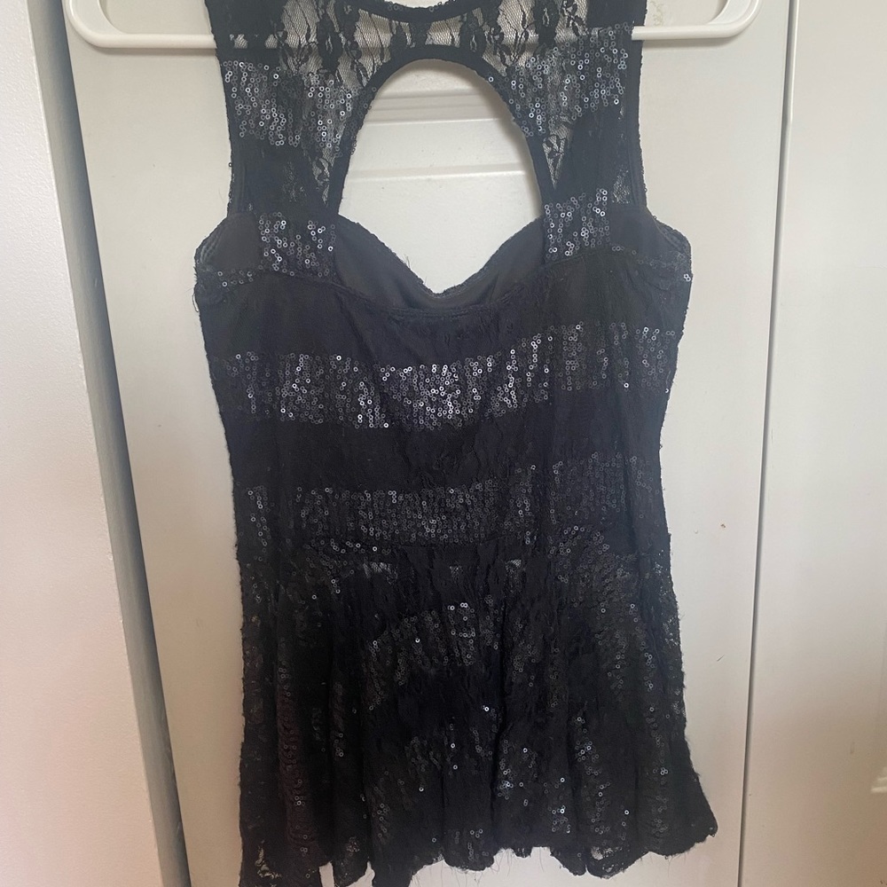 Cute and flirty going out top that hugs your curves above.
